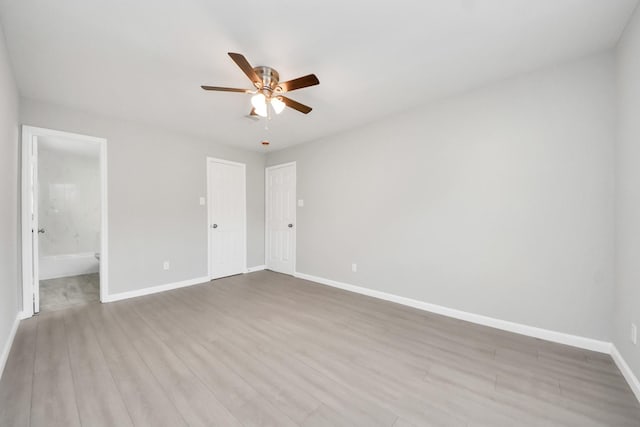 5911 Southurst St, Houston, TX 77033 - unfurnished bedroom featuring baseboards, wood finished floors, and a ceiling fan