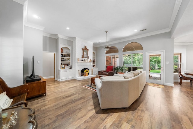 1523 Lofty Maple Trl, Kingwood, TX 77345 - living area with a fireplace, recessed lighting, ceiling fan, light wood-type flooring, and baseboards