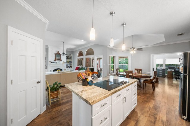 1523 Lofty Maple Trl, Kingwood, TX 77345 - kitchen with a ceiling fan, black appliances, open floor plan, a large fireplace, and crown molding