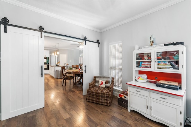 1523 Lofty Maple Trl, Kingwood, TX 77345 - living area with a barn door, dark wood-style flooring, and crown molding