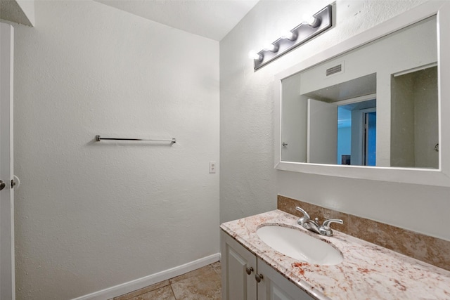 12500 Sandpiper Dr Unit 5, Houston, TX 77035 - bathroom with vanity, tile patterned floors, and baseboards