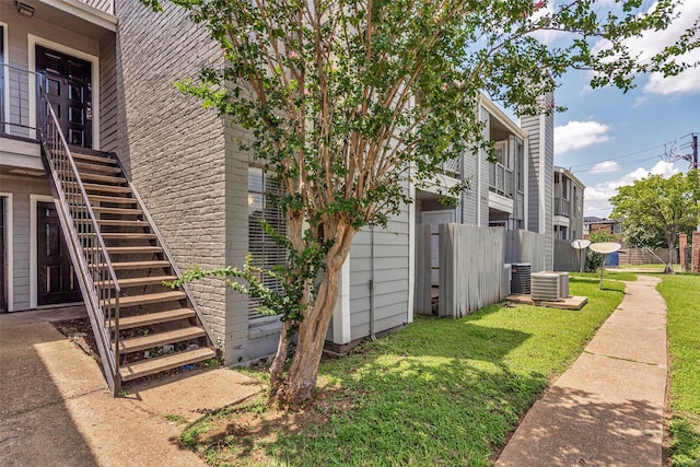 12500 Sandpiper Dr Unit 5, Houston, TX 77035 - view of property exterior featuring stairs and central AC unit