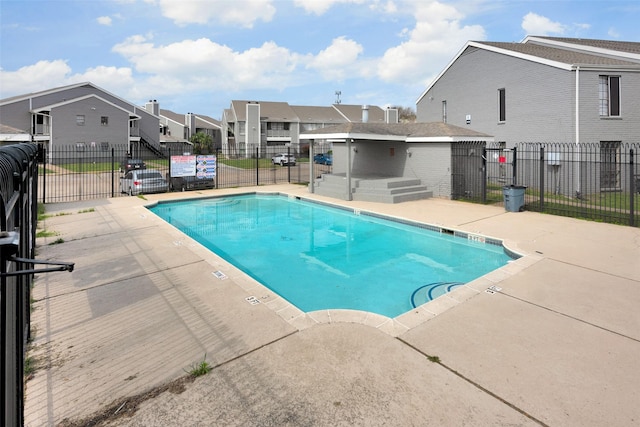 12500 Sandpiper Dr Unit 5, Houston, TX 77035 - community pool featuring a residential view and a patio area