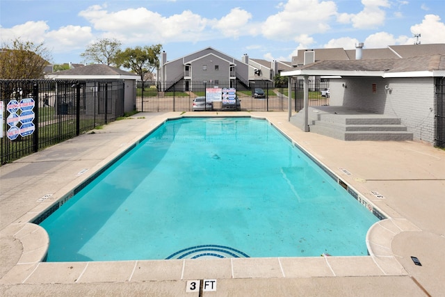 12500 Sandpiper Dr Unit 5, Houston, TX 77035 - community pool featuring a residential view and a patio area