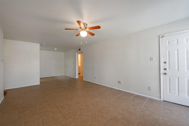 12500 Sandpiper Dr Unit 5, Houston, TX 77035 - unfurnished room with ceiling fan, light tile patterned floors, and baseboards