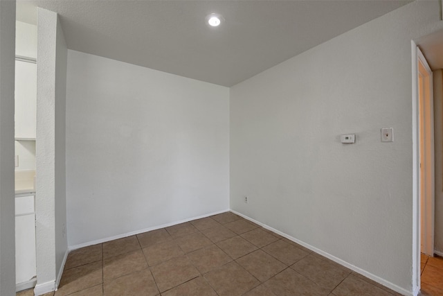 12500 Sandpiper Dr Unit 5, Houston, TX 77035 - empty room with tile patterned floors and baseboards