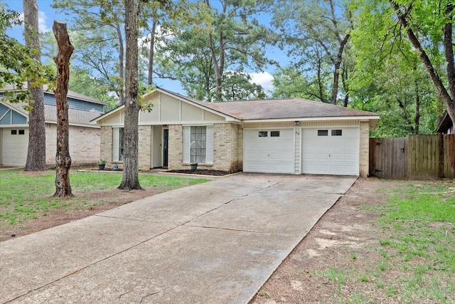 56 Oldstream Ct, The Woodlands, TX 77381 - mid-century home with driveway, a garage, and brick siding