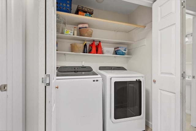56 Oldstream Ct, The Woodlands, TX 77381 - laundry room with washer and clothes dryer