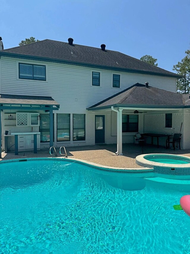 16218 Coral Bay St, Crosby, TX 77532 - view of pool featuring a patio area, area for grilling, a ceiling fan, and a pool with connected hot tub