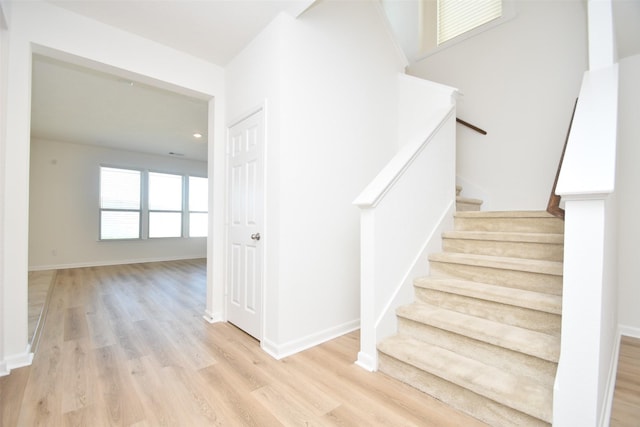 14623 Monterey Cypress Dr, Houston, TX 77068 - stairway featuring wood finished floors and baseboards