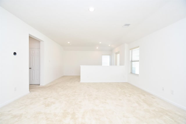 14623 Monterey Cypress Dr, Houston, TX 77068 - empty room featuring recessed lighting, light carpet, and baseboards