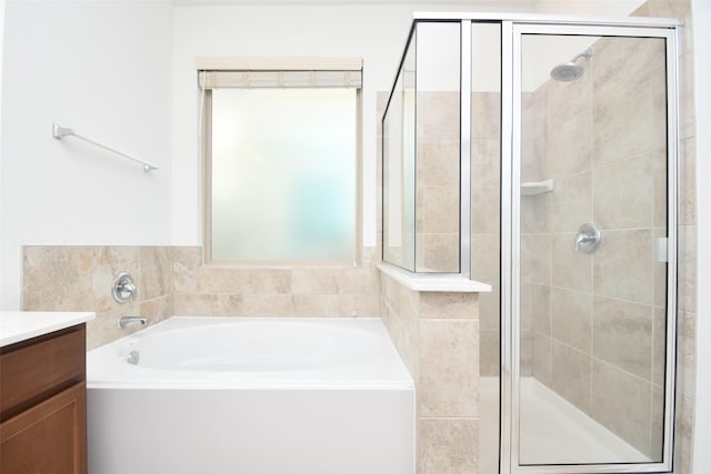 14623 Monterey Cypress Dr, Houston, TX 77068 - full bath with a stall shower, a garden tub, and vanity