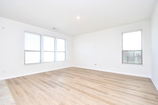 14623 Monterey Cypress Dr, Houston, TX 77068 - unfurnished room with light wood-type flooring, baseboards, and recessed lighting