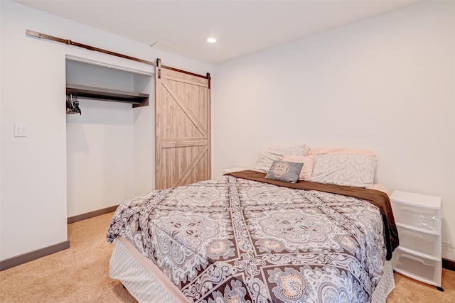 5863 Inwood Dr Unit 5, Houston, TX 77057 - bedroom with carpet floors, baseboards, a barn door, and recessed lighting