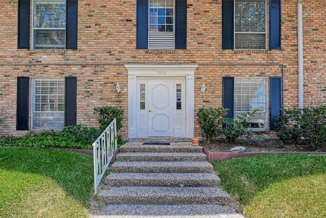 5863 Inwood Dr Unit 5, Houston, TX 77057 - entrance to property with brick siding and a lawn