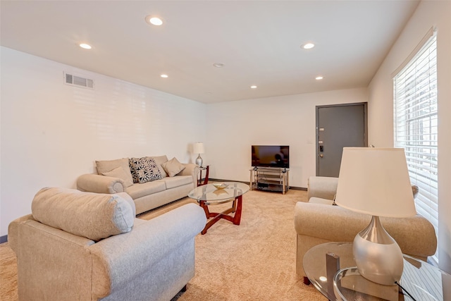 5863 Inwood Dr Unit 5, Houston, TX 77057 - living area featuring light colored carpet, recessed lighting, and baseboards