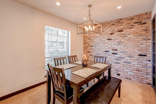 5863 Inwood Dr Unit 5, Houston, TX 77057 - dining room with light colored carpet, brick wall, a chandelier, recessed lighting, and baseboards