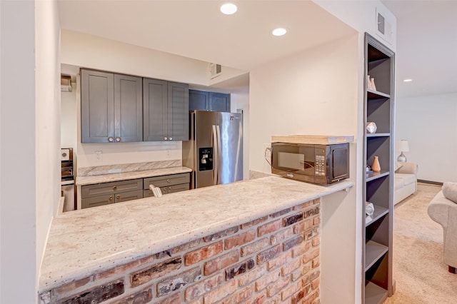5863 Inwood Dr Unit 5, Houston, TX 77057 - kitchen with stainless steel refrigerator with ice dispenser, black microwave, open shelves, carpet, and recessed lighting