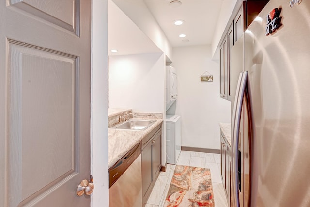 5863 Inwood Dr Unit 5, Houston, TX 77057 - bathroom featuring vanity, washing machine and dryer, baseboards, and recessed lighting