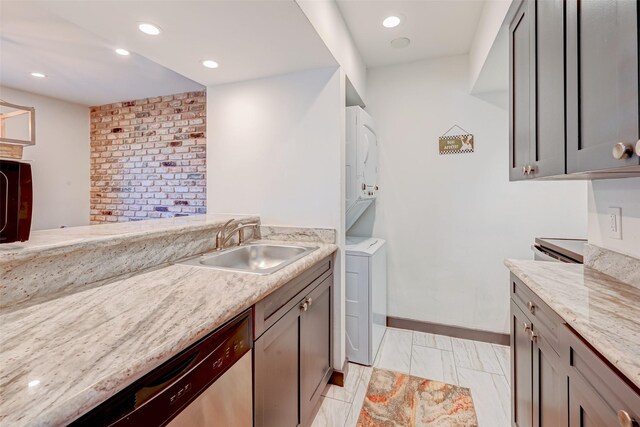 5863 Inwood Dr Unit 5, Houston, TX 77057 - laundry room with light marble finish floors, recessed lighting, and baseboards