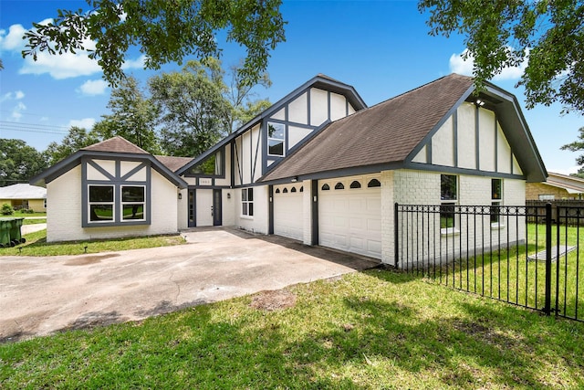 1003 Crescent Blvd, Cleveland, TX 77327 - tudor-style house with concrete driveway, roof with shingles, brick siding, and a garage