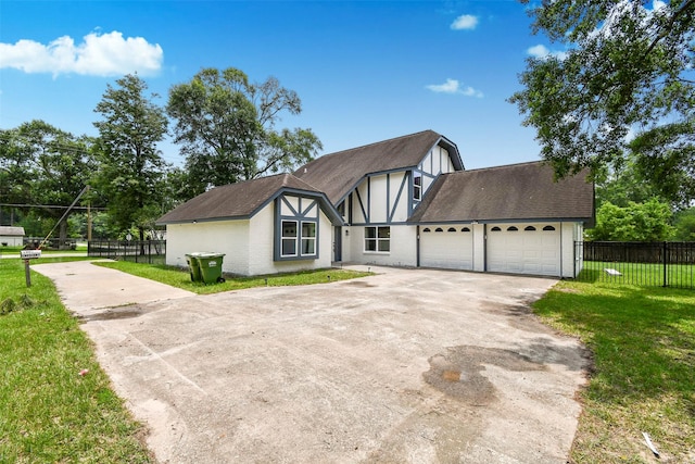 1003 Crescent Blvd, Cleveland, TX 77327 - tudor home featuring concrete driveway, roof with shingles, and an attached garage