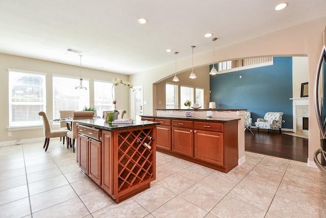26706 Grey Swan Dr, Katy, TX 77494 - kitchen with a kitchen island, healthy amount of natural light, recessed lighting, and light tile patterned floors