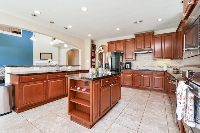26706 Grey Swan Dr, Katy, TX 77494 - kitchen featuring stainless steel appliances, a center island, open shelves, backsplash, and under cabinet range hood