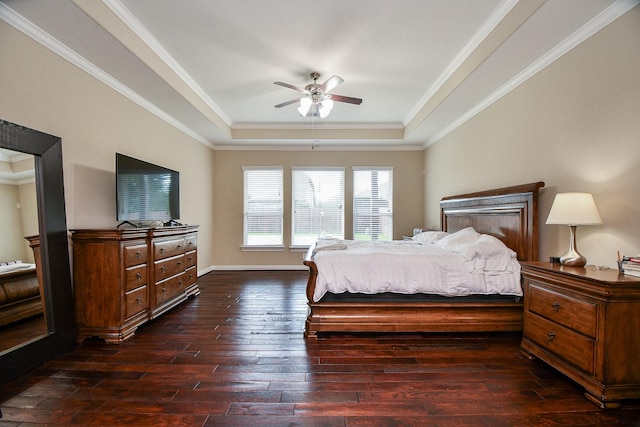 26706 Grey Swan Dr, Katy, TX 77494 - bedroom with a tray ceiling, dark wood-type flooring, ornamental molding, a ceiling fan, and baseboards