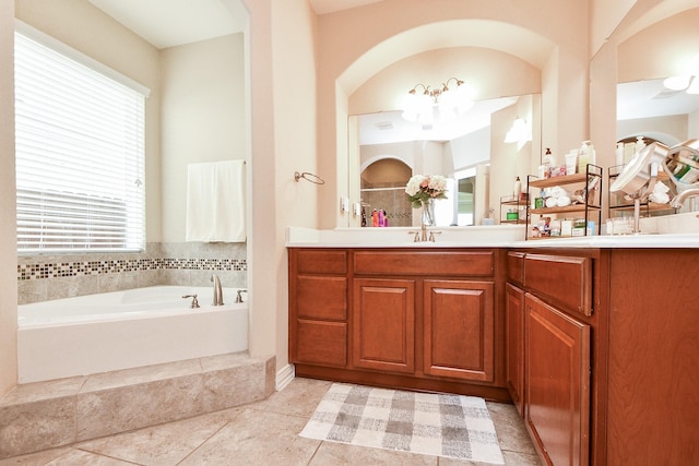 26706 Grey Swan Dr, Katy, TX 77494 - full bathroom with vanity, a bath, and a chandelier