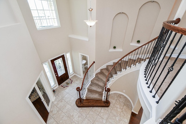 26706 Grey Swan Dr, Katy, TX 77494 - foyer with a high ceiling, stairs, and baseboards
