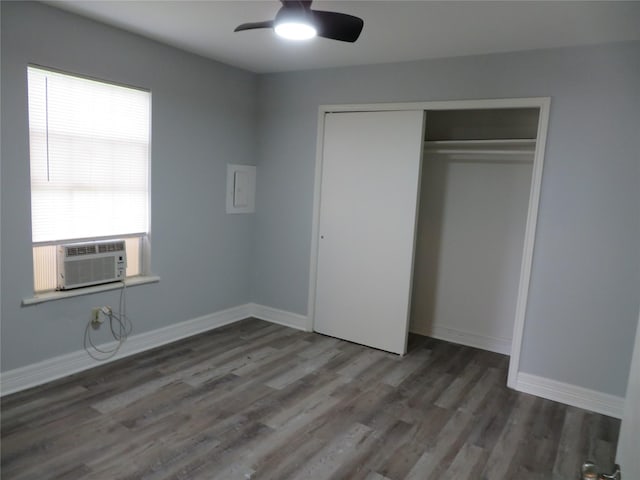 1103 Jocelyn St, Houston, TX 77023 - unfurnished bedroom with wood finished floors, cooling unit, a closet, baseboards, and a ceiling fan