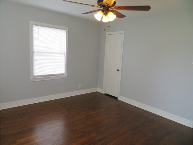 1103 Jocelyn St, Houston, TX 77023 - spare room with ceiling fan, dark wood-style flooring, and baseboards