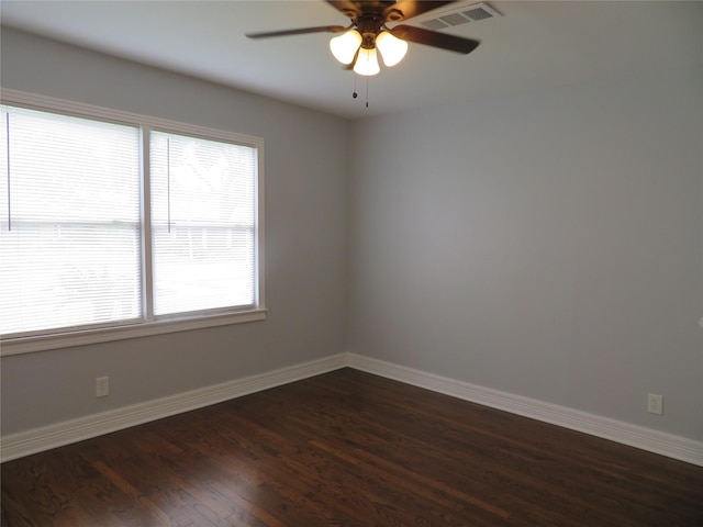 1103 Jocelyn St, Houston, TX 77023 - spare room with plenty of natural light, dark wood-style floors, baseboards, and ceiling fan
