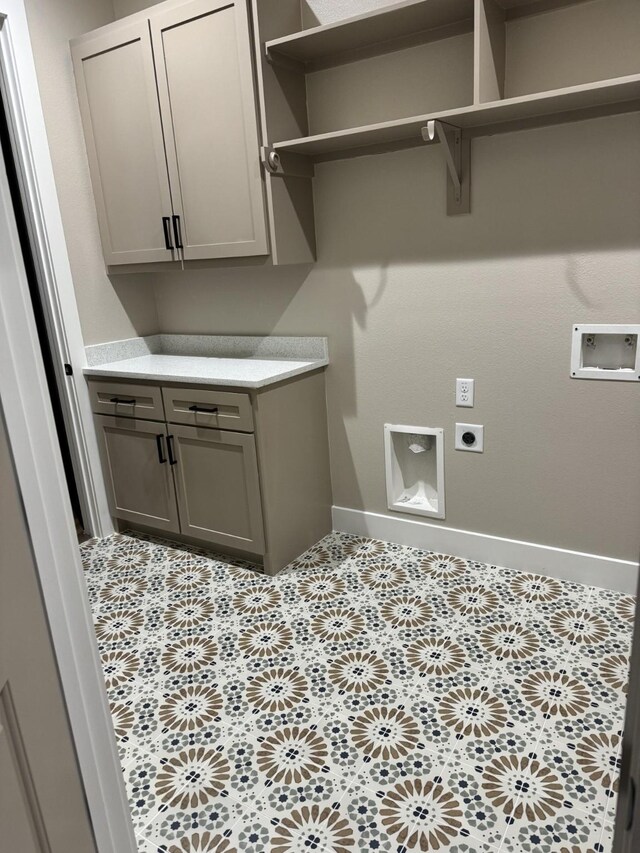 262 Rd 660, Dayton, TX 77535 - laundry room featuring hookup for an electric dryer, washer hookup, baseboards, and cabinet space