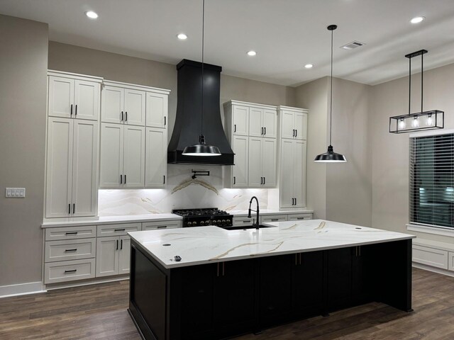 262 Rd 660, Dayton, TX 77535 - kitchen featuring custom exhaust hood, dark wood-style flooring, a sink, white cabinets, and recessed lighting