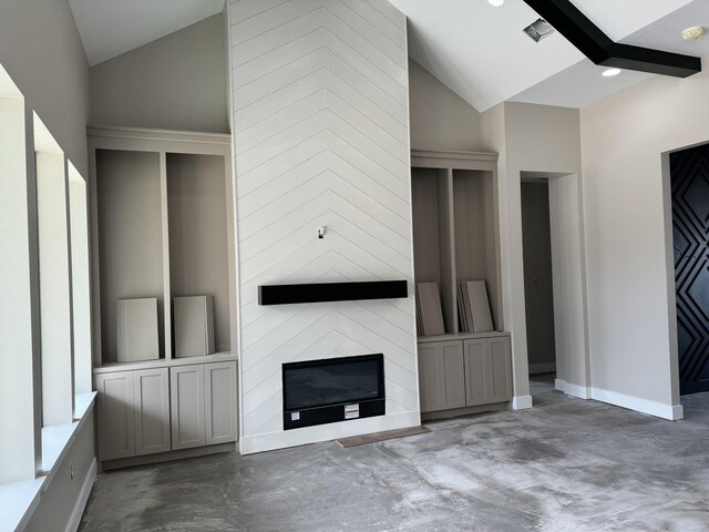 262 Rd 660, Dayton, TX 77535 - unfurnished living room featuring lofted ceiling, finished concrete flooring, a fireplace, and baseboards