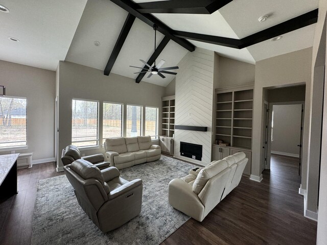 262 Rd 660, Dayton, TX 77535 - living room with baseboards, dark wood-type flooring, a ceiling fan, built in features, and a fireplace