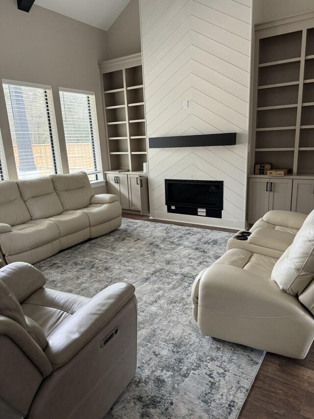 262 Rd 660, Dayton, TX 77535 - living room with wood finished floors, a fireplace, built in features, and vaulted ceiling