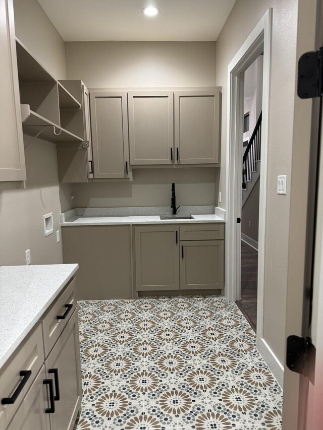 262 Rd 660, Dayton, TX 77535 - washroom featuring washer hookup, recessed lighting, and cabinet space