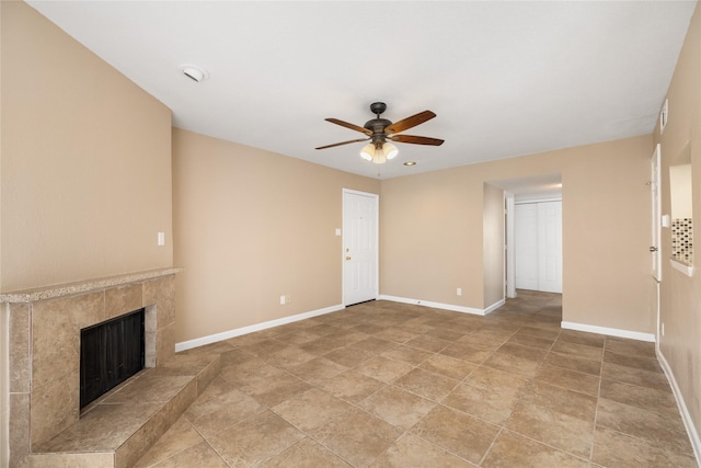 16111 Aspenglenn Dr Unit 803, Houston, TX 77084 - unfurnished living room with ceiling fan, a premium fireplace, and baseboards