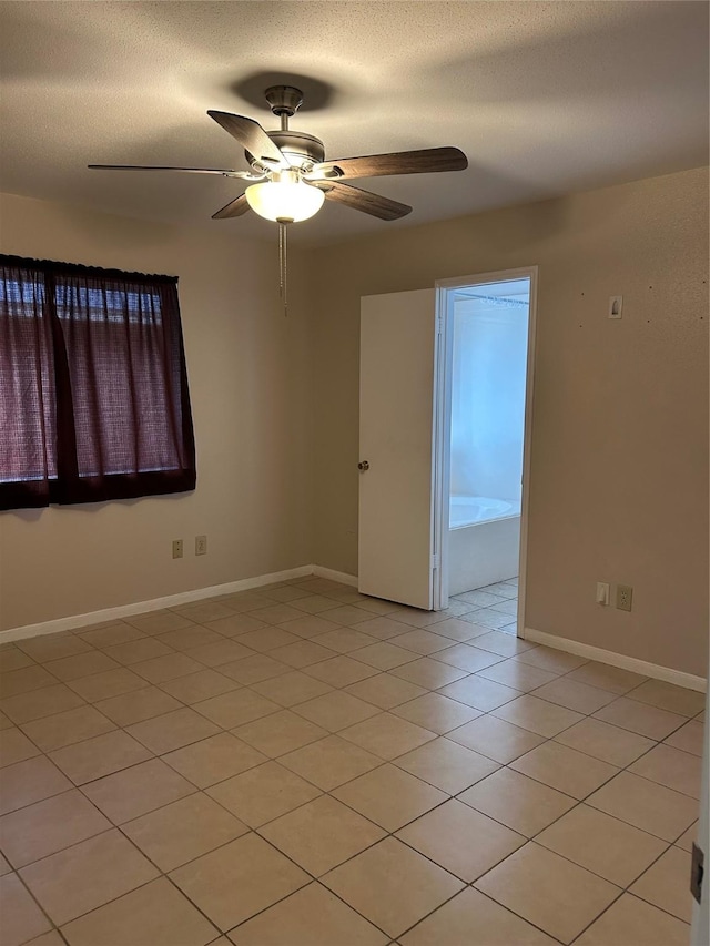 18727 Parfield Ln, Houston, TX 77084 - empty room featuring ceiling fan, baseboards, and light tile patterned floors