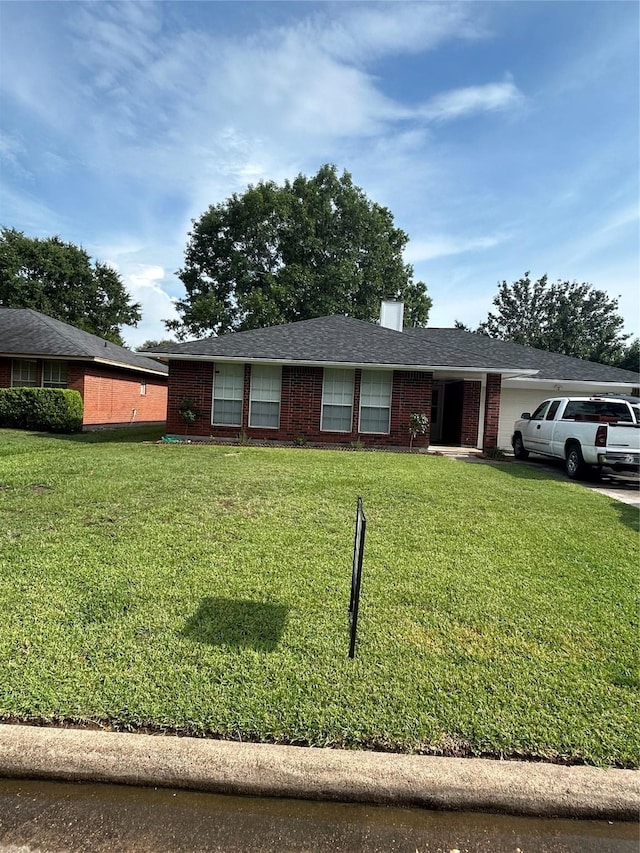 18727 Parfield Ln, Houston, TX 77084 - single story home featuring a front lawn, a garage, and brick siding