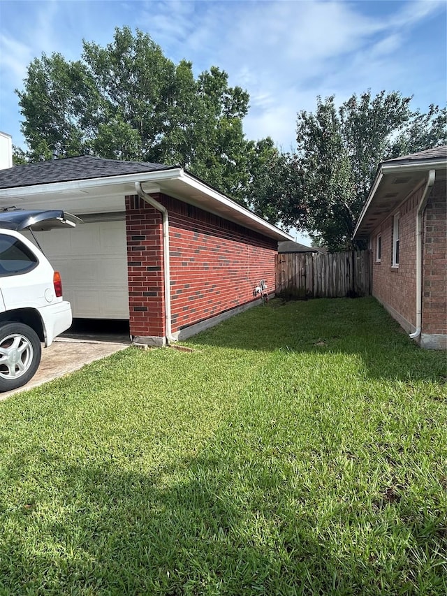18727 Parfield Ln, Houston, TX 77084 - view of property exterior featuring brick siding, a garage, and driveway