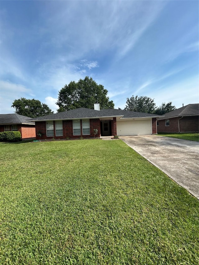 18727 Parfield Ln, Houston, TX 77084 - ranch-style home with brick siding, driveway, a garage, a chimney, and a front lawn