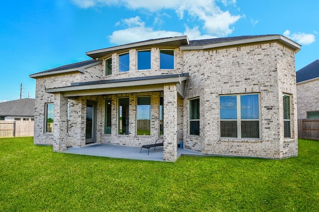 31142 Crescent Hill Dr, Fulshear, TX 77441 - rear view of house with a patio and brick siding