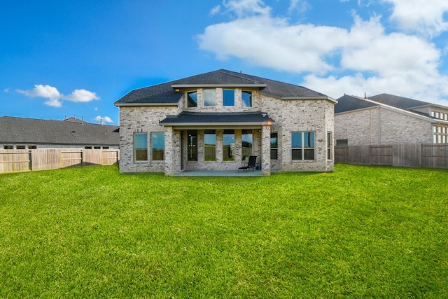 31142 Crescent Hill Dr, Fulshear, TX 77441 - back of property with a patio and brick siding
