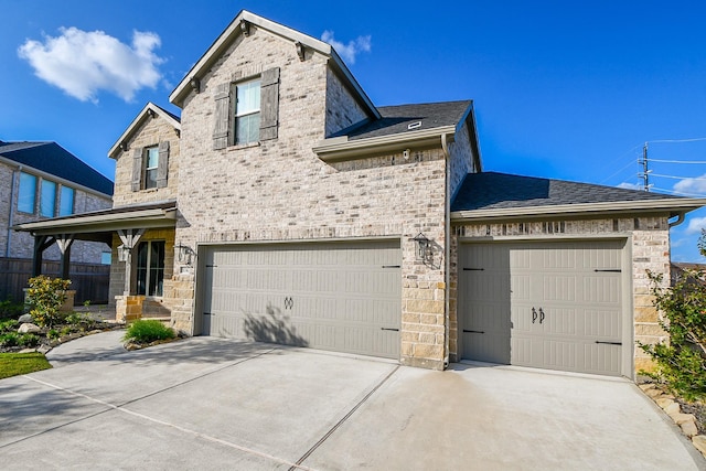 31142 Crescent Hill Dr, Fulshear, TX 77441 - view of front of home featuring driveway, a shingled roof, and stone siding