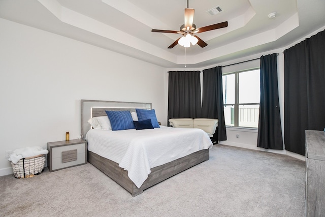 31142 Crescent Hill Dr, Fulshear, TX 77441 - bedroom featuring a tray ceiling, carpet floors, baseboards, and ceiling fan