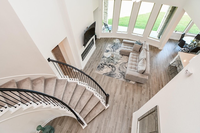 31142 Crescent Hill Dr, Fulshear, TX 77441 - stairway with wood finished floors and baseboards